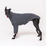 Greyhound dog wearing Snootly fluffy reversible sweater in charcoal grey on white background