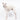 Italian Greyhound dog wearing a fluffy reversible sleeveless sweater/jumper in vanilla/white colour standing left side on